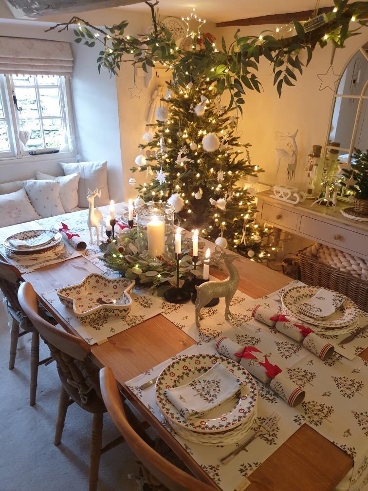 A tradition Christmas tablescape in a decorated dining room