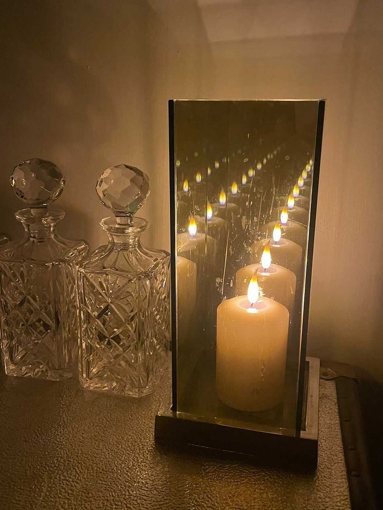 candle reflection in mirror